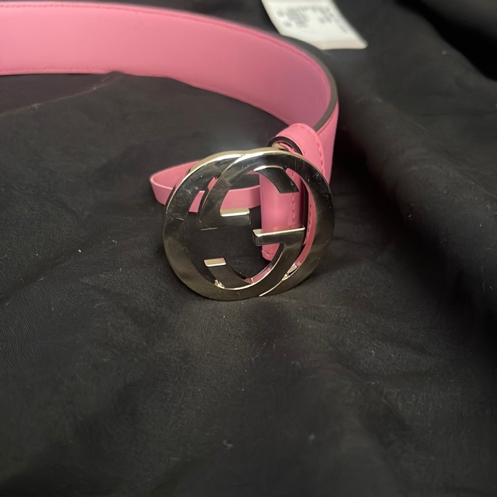 PINK GUCCI BELT NEVER WORN ORIG. ANY BELT STORE WILL ADD EXTRA HOLES FOR 10$